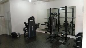 a gym with several tread machines in a room at Freedive Panglao Resort in Panglao Island