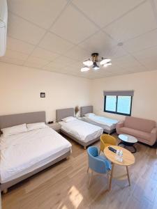 Postel nebo postele na pokoji v ubytování Fu Courtyard Homestay