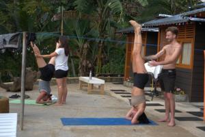 a group of people in a yoga class at Tomorrowland in Ella