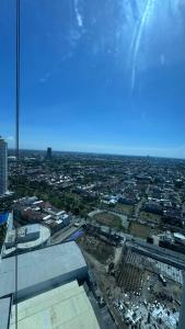 a view of a city from the top of a building at Apartemen Anderson 28 1 Pakuwon mall Luxury Studio Apartment Connecting Mall, Pool & City View in Surabaya +1 photo