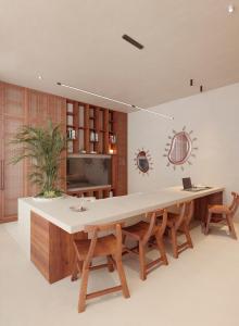 a large dining room with a large table and chairs at Gate 11 Apartments in Denpasar