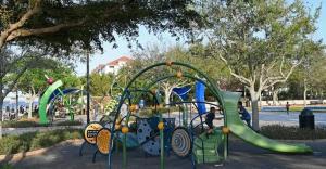 a playground with a slide in a park at Luxe King Studio Near AMI! Beach Gear & Fast WiFi in Bradenton