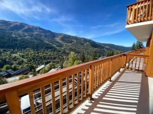 a balcony with a view of the mountains at Bel appartement à Méribel, balcon, 3 min. télésiège et commerces - FR-1-411-997 in Mussillon +6 photos