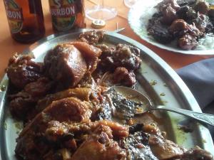 a plate of food on a table with a spoon at Chambres d'hôtes aux Avirons - Séjour créole authentique - FR-1-786-67 in Ravine Sèche