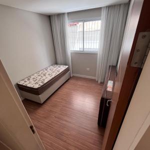 Ένα ή περισσότερα κρεβάτια σε δωμάτιο στο Apartamento Praia do morro 350mt da praia 2 quartos