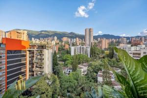 a view of a city with buildings and trees at Morph 1201 - Elegant/Modern Apt in Poblado in El Poblado