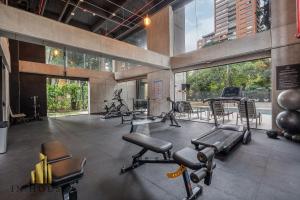 a gym with many exercise equipment in a building at Morph 1201 - Elegant/Modern Apt in Poblado in El Poblado