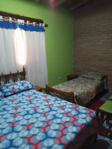 Katil atau katil-katil dalam bilik di Cabaña en Arroyo de los Patos