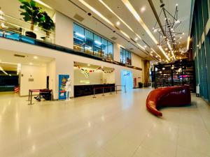 a large hall with a slide in the middle of it at Luxury Mercu Summer Suites KLCC By JT in Kuala Lumpur +70 photos