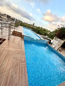 Πισίνα στο ή κοντά στο APPARTEMENT MODERNE AVEC PISCINE-ASCENSEUR DEUX PLATEAU,abidjan