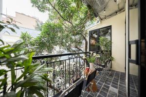 a balcony with plants and benches on a building at La Belle Sol Villa in Heart of City Center-Free Laundry in Hanoi
