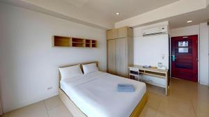 Postel nebo postele na pokoji v ubytování Seabreeze Bangsaen