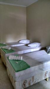 Cama ou camas em um quarto em Hotel Pousada do Papa