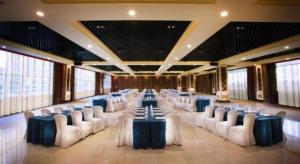 a large banquet hall with white chairs and tables at Tongxiang Inspirock Hotel in Jiaxing +214 photos