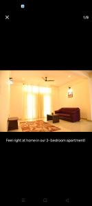 a hotel room with a bed and a window at Daffodil serviced apartments in Mysore