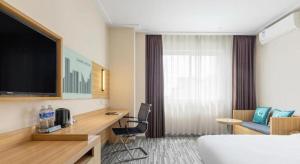 TV/trung tâm giải trí tại City Comfort Inn Dongguan Shilong Huixing Commercial Center