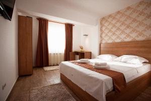 Lova arba lovos apgyvendinimo įstaigoje Hotel Nova Bital
