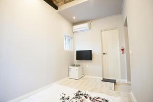 TV a/nebo společenská místnost v ubytování Daemyung Guesthouse