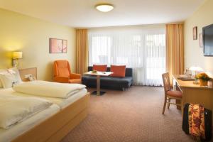 Postel nebo postele na pokoji v ubytování Kur- und Wellnesshotel Förch