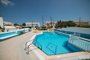 a large swimming pool in a resort at Villa Stella Apartments by Estia in Stalís