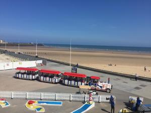 a view of a beach with a playground and the ocean at Spaview in Bridlington