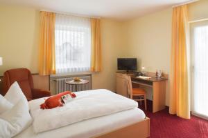 Postel nebo postele na pokoji v ubytování Kur- und Wellnesshotel Förch