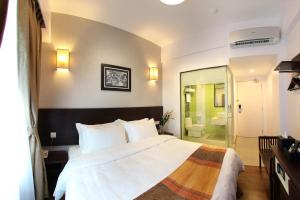 Postel nebo postele na pokoji v ubytování Hotel Richbaliz Selayang