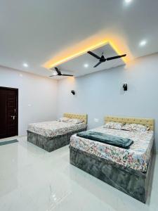 Ένα ή περισσότερα κρεβάτια σε δωμάτιο στο Suits by lowtide homestay