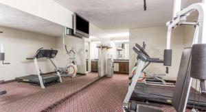a room with a gym with two tread machines at Ramada Limited Norfolk in Norfolk +14 photos