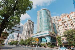 a large city with tall buildings and a street at Grand Soluxe Zhongyou Hotel Shenzhen in Shenzhen