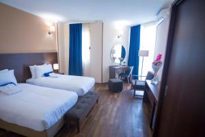 Postel nebo postele na pokoji v ubytování Hotel Corner Inn