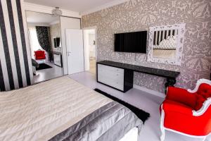 Ένα ή περισσότερα κρεβάτια σε δωμάτιο στο Pensiunea Primaverii