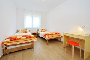 Postel nebo postele na pokoji v ubytování Luxury Apartments SIKIRIC with Fantastic View on the sea + 37 fotografií