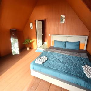 a bedroom with a large bed in a attic at Koh Ta Kiev Island Resort in Koh Ta kiev Island