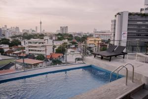 a swimming pool on the roof of a building at Trillium Boutique Express Hotel - Ward Place in Colombo