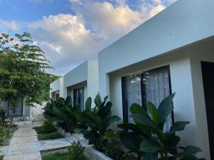 a house with plants in front of it at Dafuama Resort in Wanci
