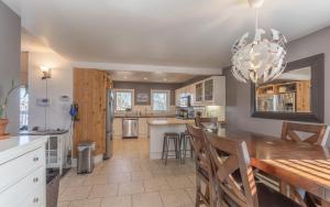 a kitchen and dining room with a table and chairs at Northern Haven Properties in Yellowknife