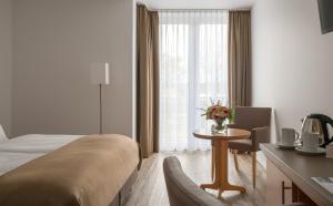 Postel nebo postele na pokoji v ubytování Hotel Chrisma