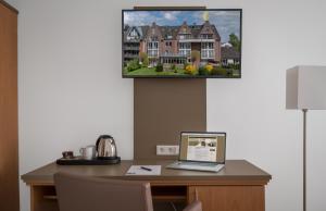 TV a/nebo společenská místnost v ubytování Hotel Chrisma