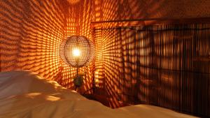 a bedroom with a bed and a lamp next to a wall at ニッポニア高原宿夢海月-ゆめみづき- in Ito +31 photos