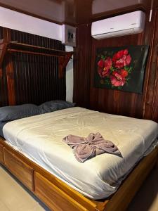 a bed with a dress on top of it at Mata palo bech club in Savegre