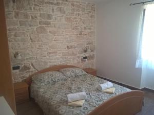 Postel nebo postele na pokoji v ubytování Barbiere Guest House