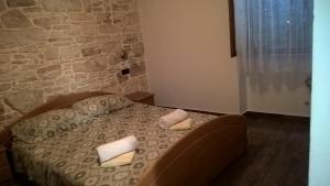 Postel nebo postele na pokoji v ubytování Barbiere Guest House