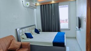 Ένα ή περισσότερα κρεβάτια σε δωμάτιο στο Arya Luxury