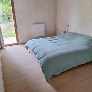 Ένα ή περισσότερα κρεβάτια σε δωμάτιο στο Gîte de la douce évasion +4 φωτογραφίες