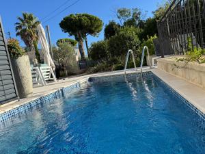 a swimming pool with a water slide in a yard at Aura Adriatica Onyx - Luxury Apartment, private pool, sea view, parking in Lovran
