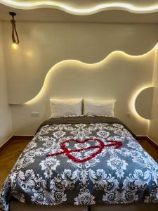 a bedroom with a bed with a heart design on it at Soho Heaven - Cloud & Relaxation Atmosphere 2 Bedrooms in Essaouira