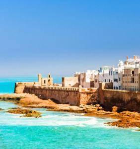 a view of a city with blue water and buildings at Soho Heaven - Cloud & Relaxation Atmosphere 2 Bedrooms in Essaouira