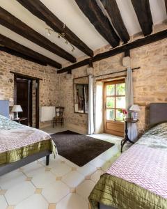 Postel nebo postele na pokoji v ubytování Auberge des Hirondelles