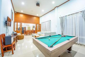 a living room with a pool table in it at White Sand Pool Villa Pattaya in Jomtien Beach